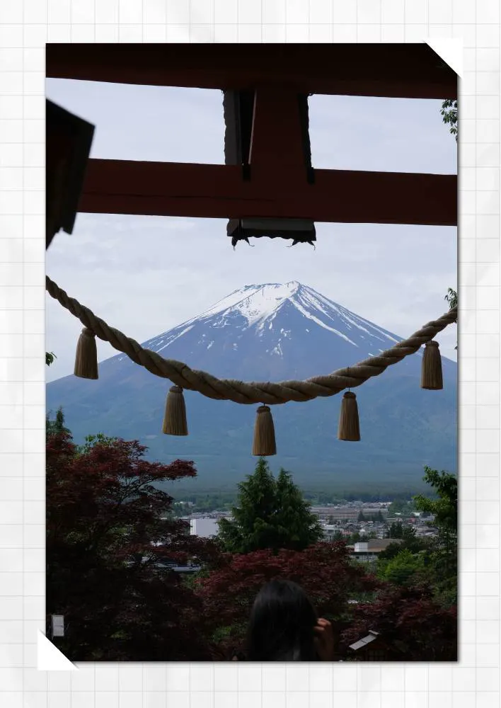 Mount Fuji framed by a shrine rope